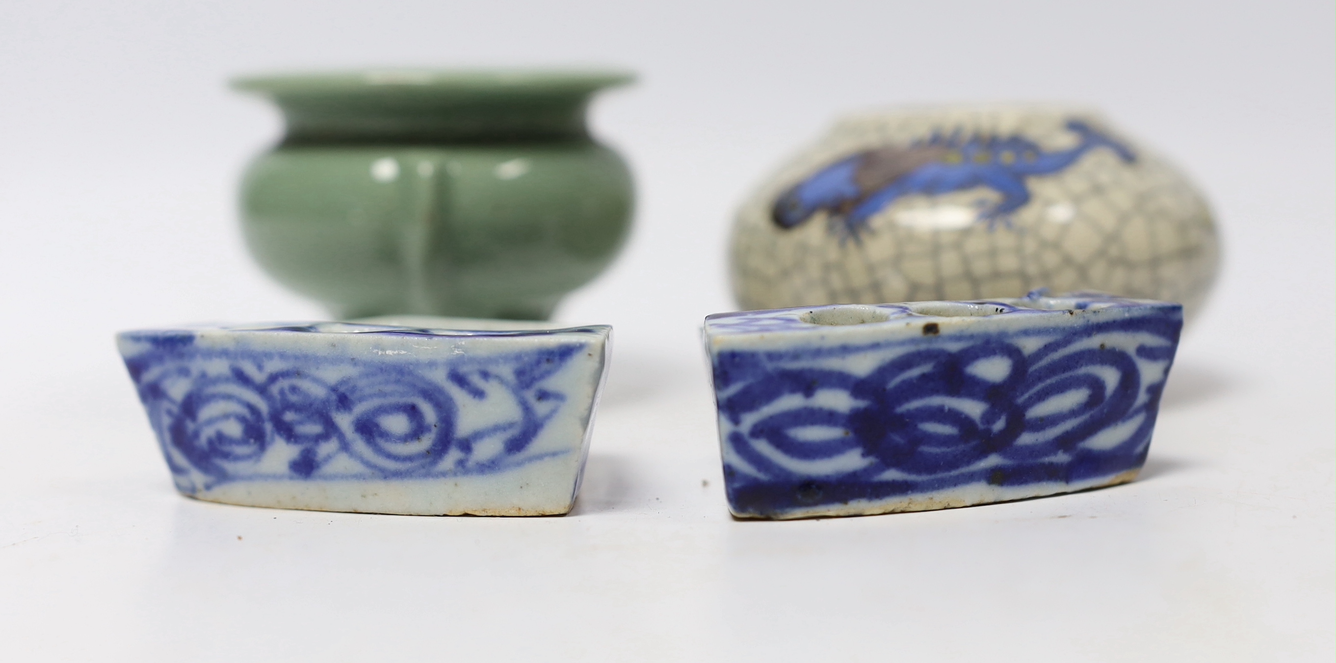 Four Chinese ceramic items; a celadon glazed tripod censer, a miniature vase and two incense holders, censer 5.5cm high